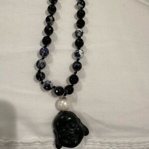 Black beaded necklace with pearl and hanging Buddha